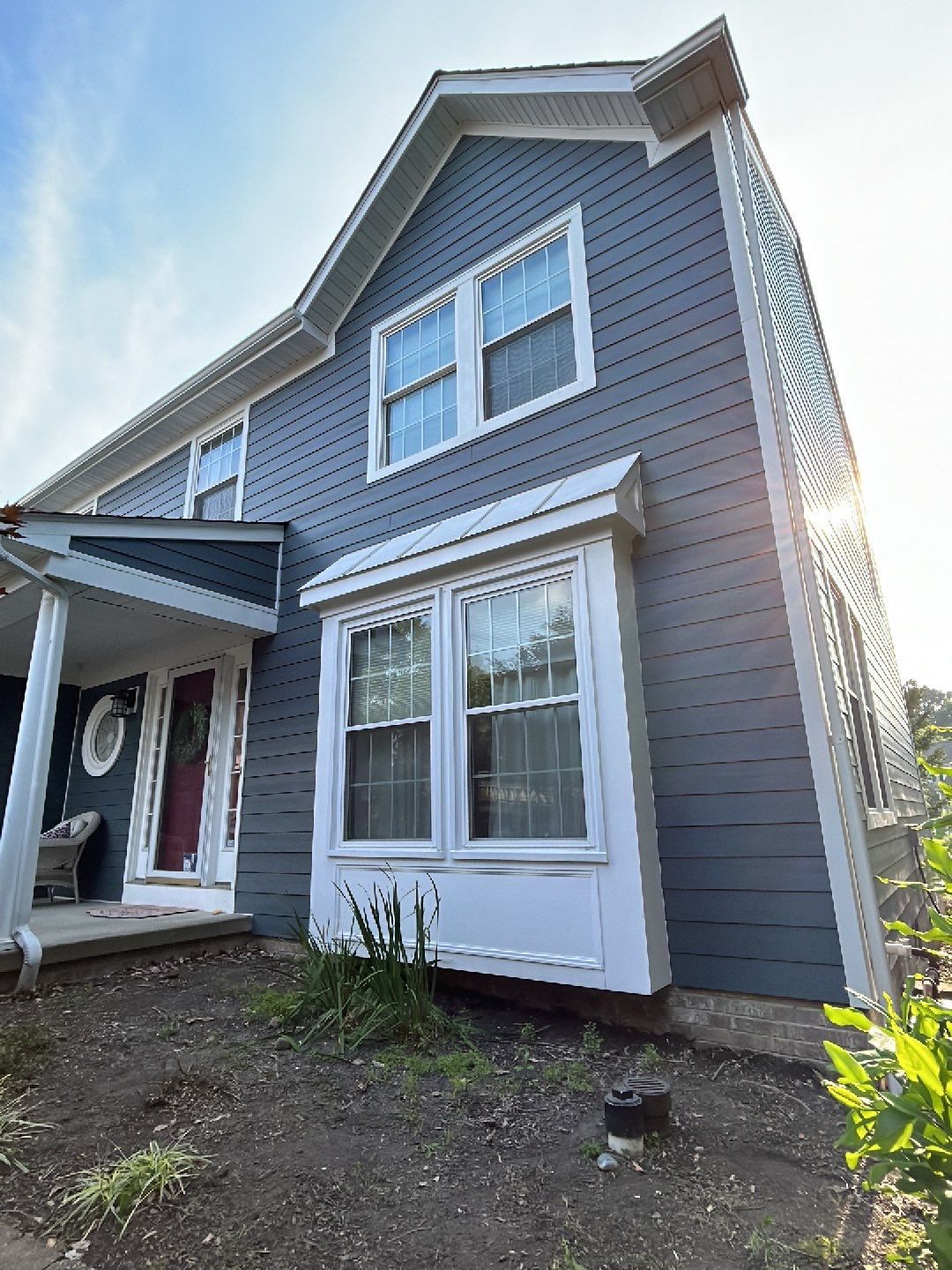 Big Fish Roofing Pittsburgh PA James Hardie lap siding blue residential home exterior