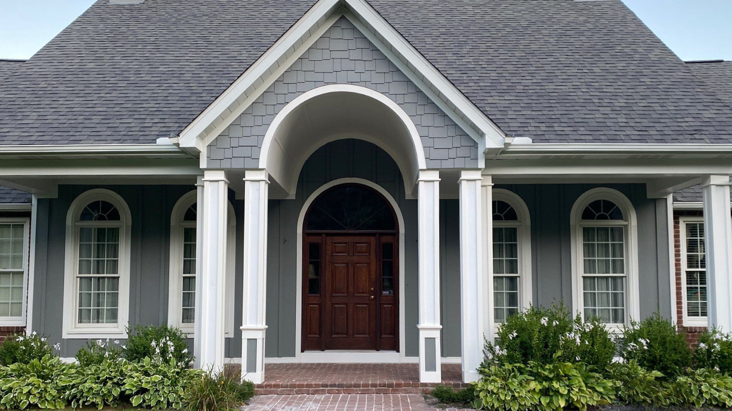 Big Fish Roofing Pittsburgh PA James Hardie siding gray home white columns residential